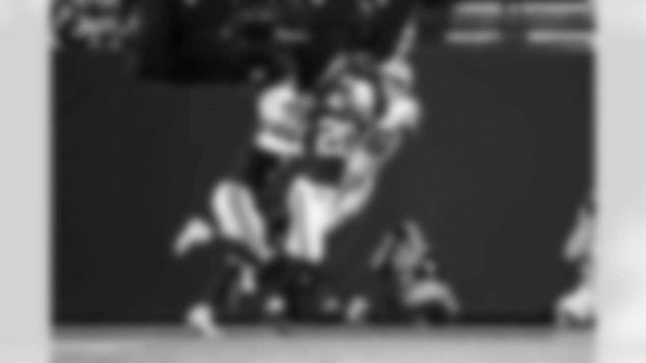 S Camryn Bynum #0 and S Nick Cross #20