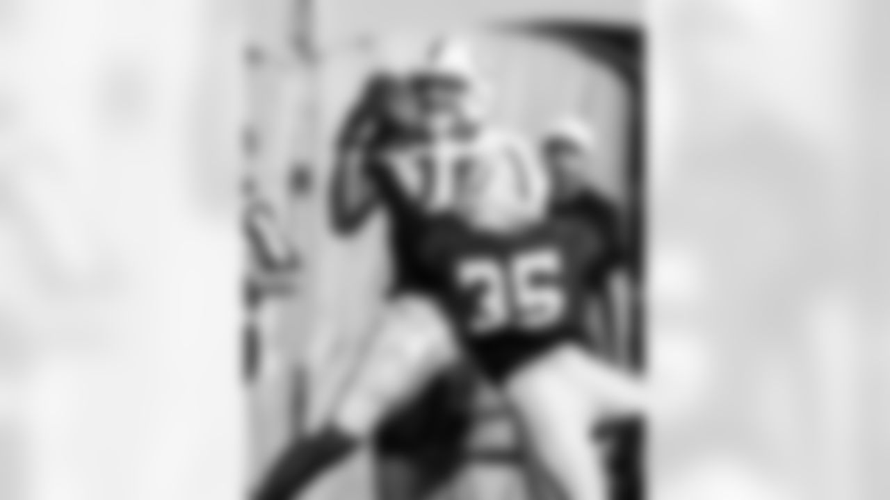WR Adonai Mitchell #10 and CB Johnathan Edwards #35