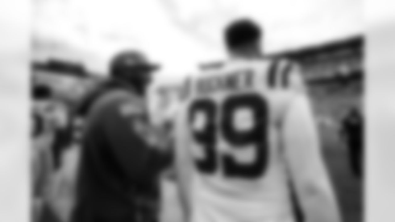 DE Tyquan Lewis #94 and DT DeForest Buckner #99