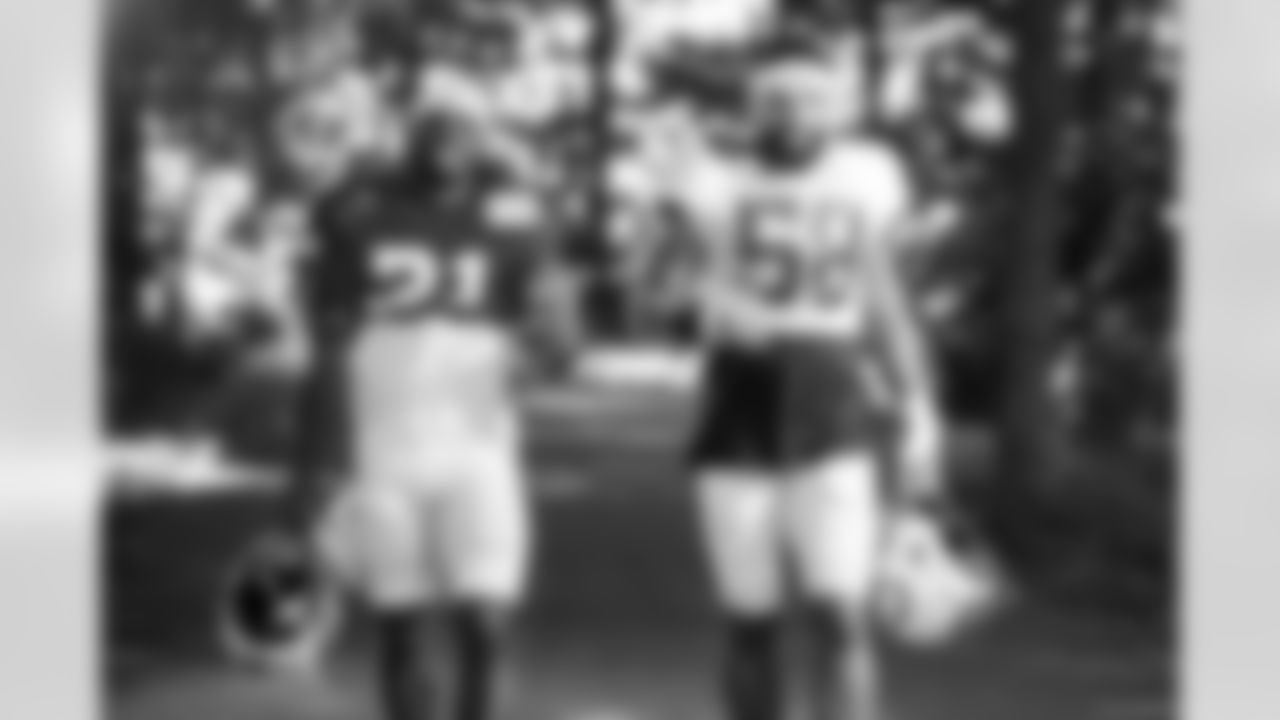 RB Tyler Goodson #31 and LB Austin Ajiake #58
