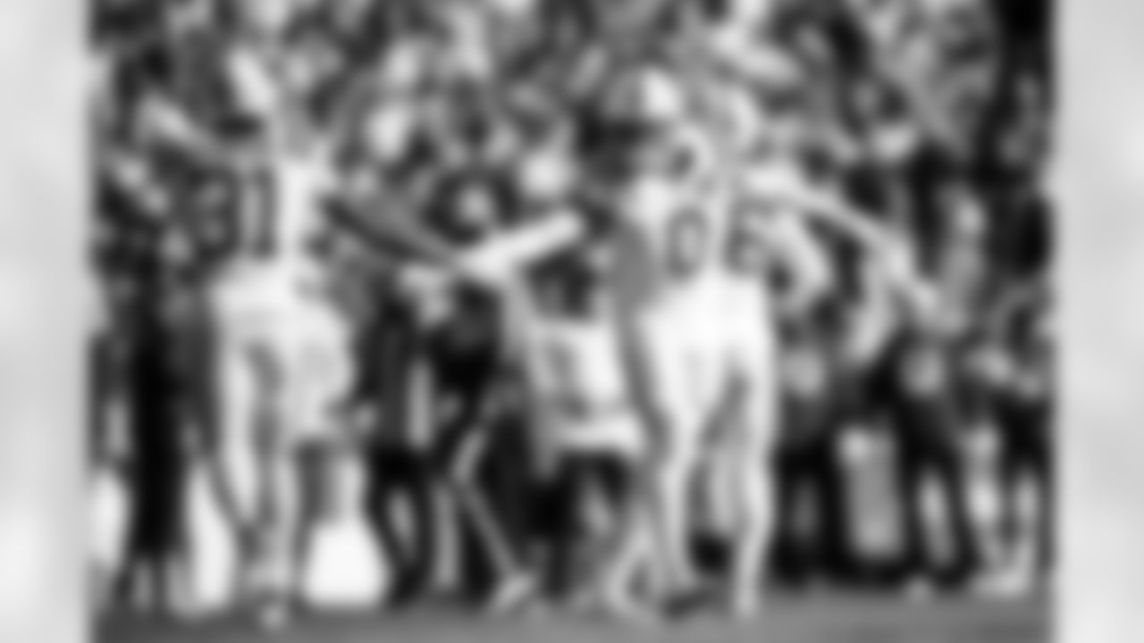 RB Tyler Goodson #31 and S Camryn Bynum #0