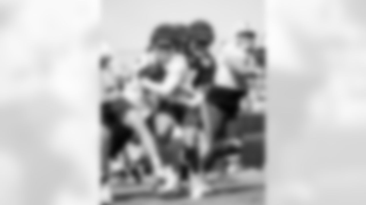 RB Jonathan Taylor #28, DE Kwity Paye #51 and T Matt Goncalves #71
