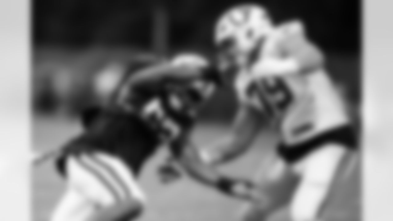 DE Samson Ebukam #52 and T Bernhard Raimann #79