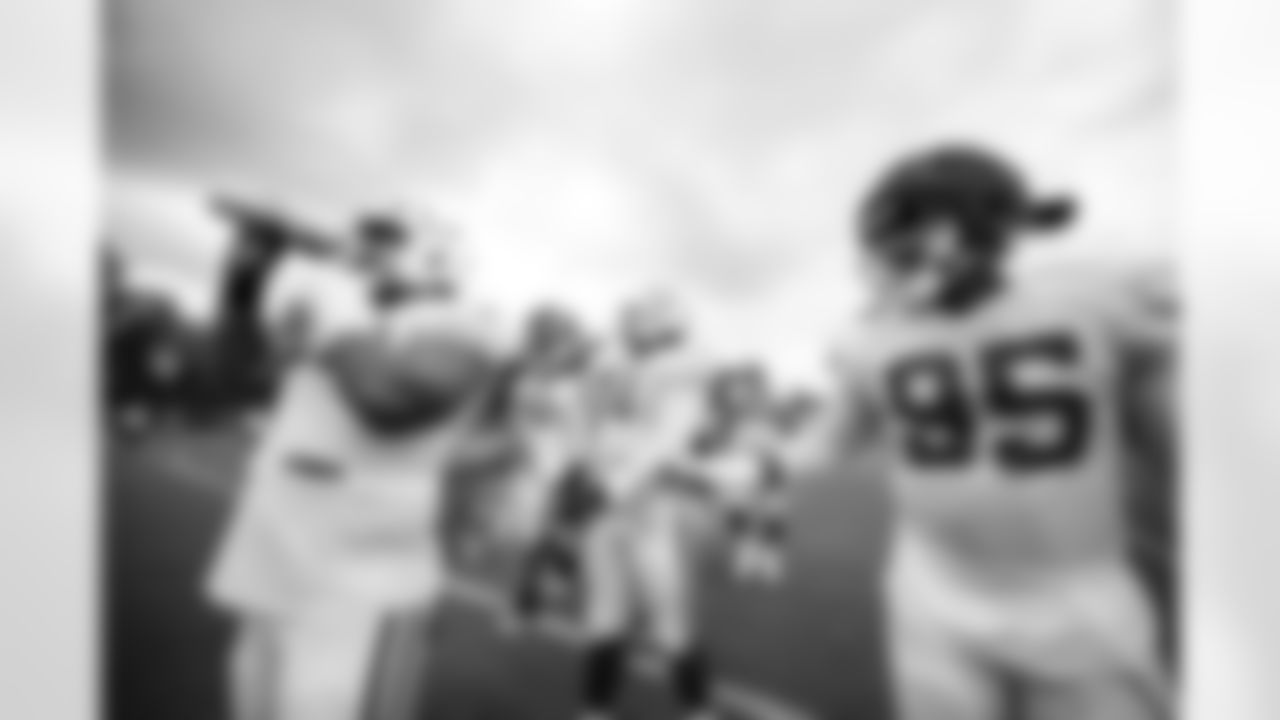 DT Josh Tupou #69 and DT Adetomiwa Adebawore #95
