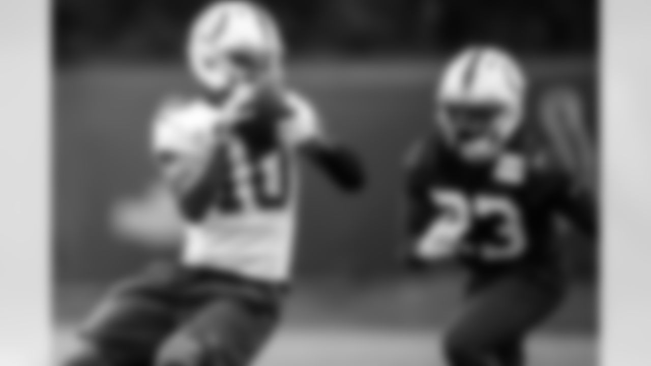 WR Adonai Mitchell #10 and CB Kenny Moore II #23