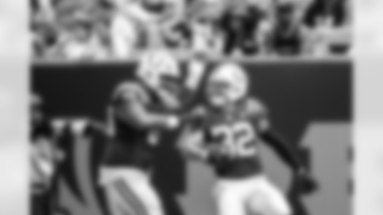 DT Josh Tupou #69 and S Daniel Scott #32