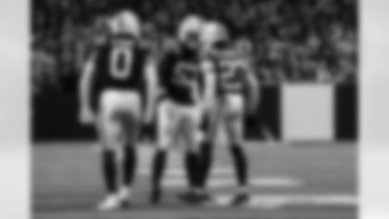 S Camryn Bynum #0, LB Germaine Pratt #53 and CB Kenny Moore II #23