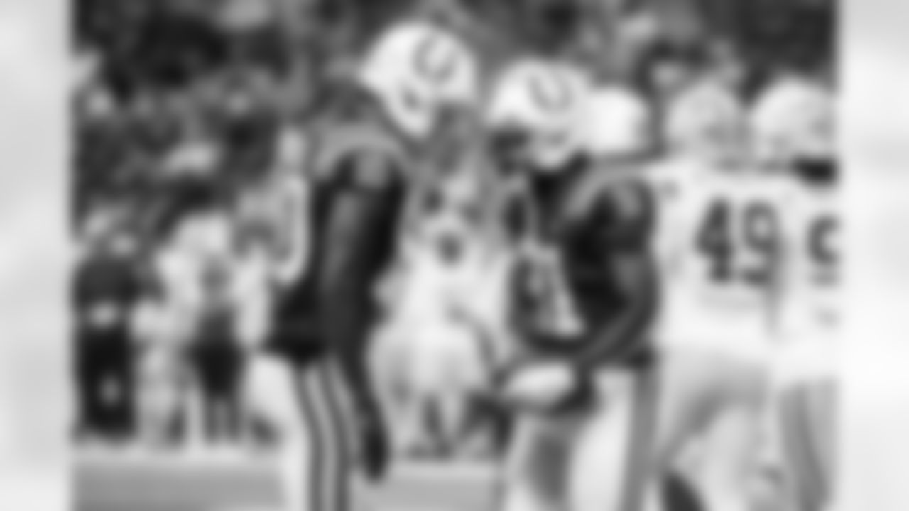 WR Adonai Mitchell #10 and RB Tyler Goodson #31