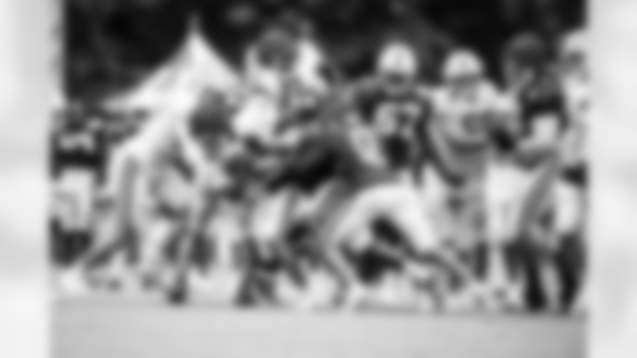 G Tanor Bortolini #60, DT Grover Stewart #90 and RB Jonathan Taylor #28