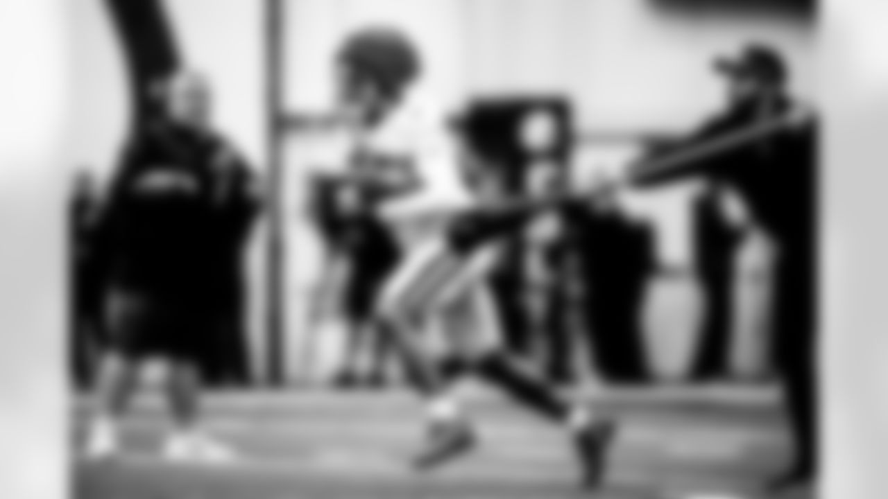 Sean Sullivan - Director of Equipment Operations, RB Jonathan Taylor #28 and Diego Ortiz - Tony Dungy Diversity Coaching Fellow