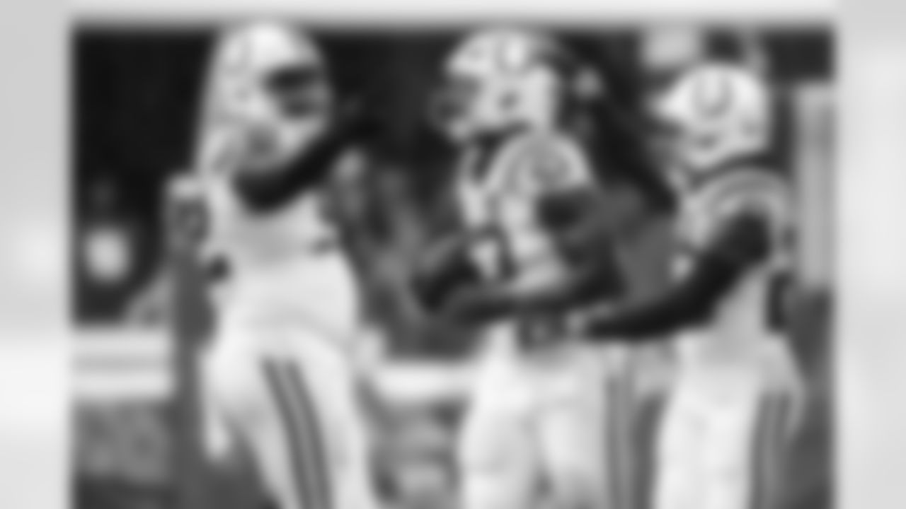 DT Neville Gallimore #92, LB Germaine Pratt #53 and CB Kenny Moore II #23