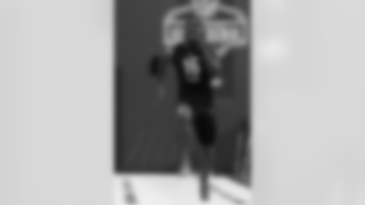 Iowa running back Tyler Goodson (16) runs the 40-yard dash at the NFL football scouting combine, Friday, March 4, 2022 in Indianapolis. (Ben Liebenberg via AP)