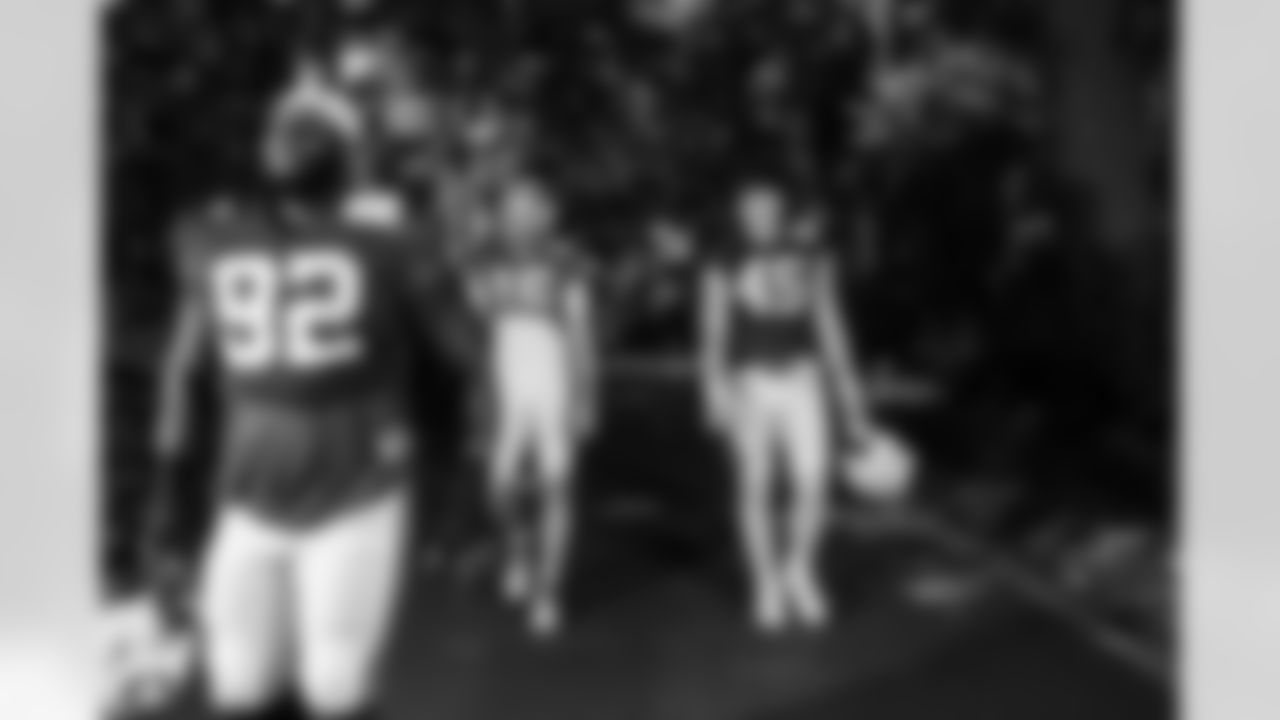 DT Neville Gallimore #92, QB Riley Leonard #15 and TE Maximilian Mang #45