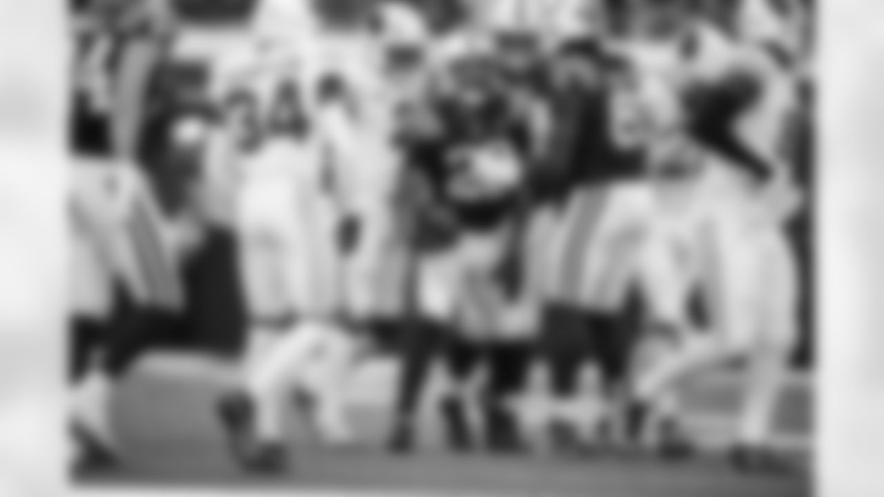 WR Ashton Dulin #16, RB Jonathan Taylor #28 and G Tanor Bortolini #60