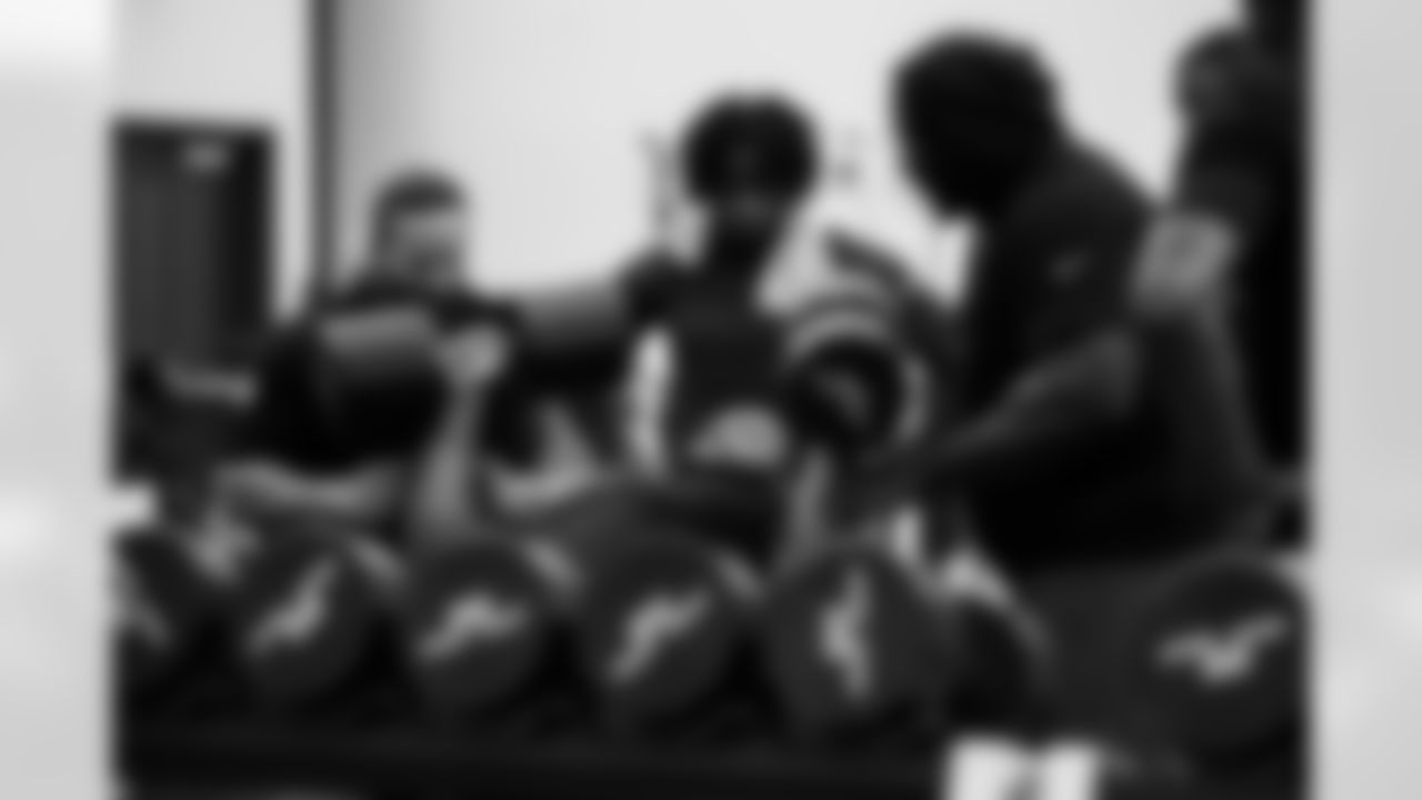 Mike Minnis Director of Sports Performance, DT Grover Stewart #90, CB Kenny Moore II #23 and DT Neville Gallimore #92