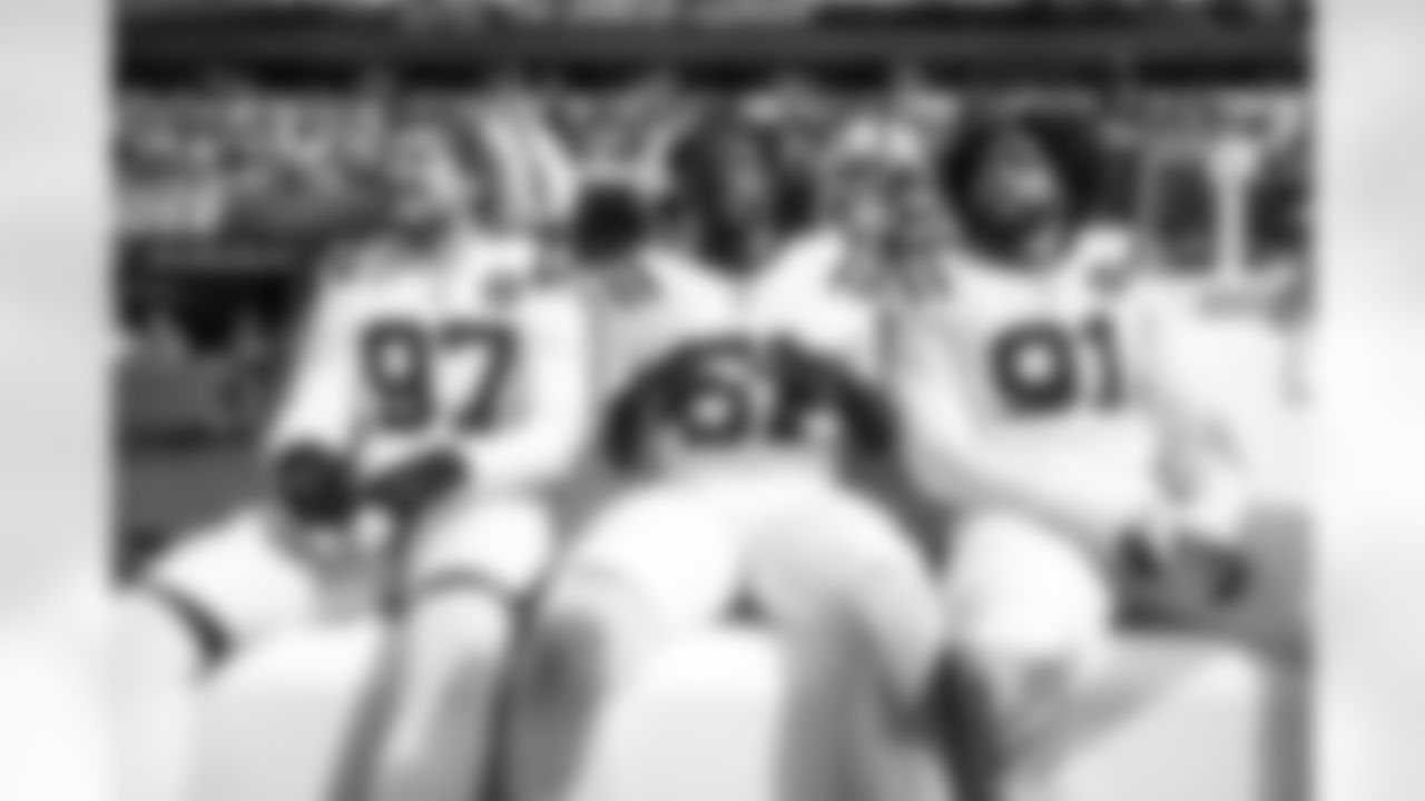 DE Laiatu Latu #97, DE Kwity Paye #51 and DE JT Tuimoloau #91