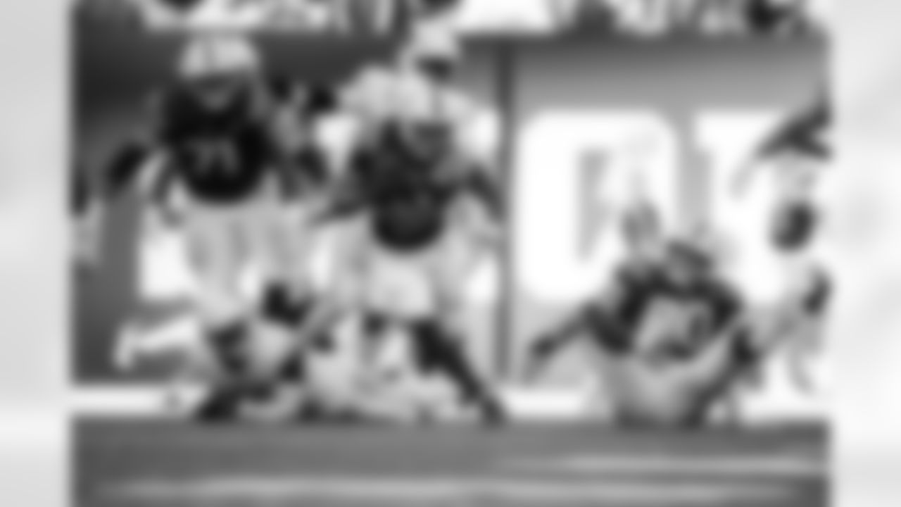 OL Matt Goncalves #71, RB Jonathan Taylor #28 and G Tanor Bortolini #60