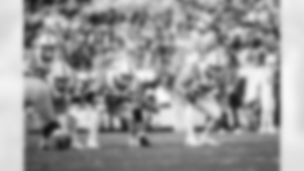 G Tanor Bortolini #60 and T Bernhard Raimann #79