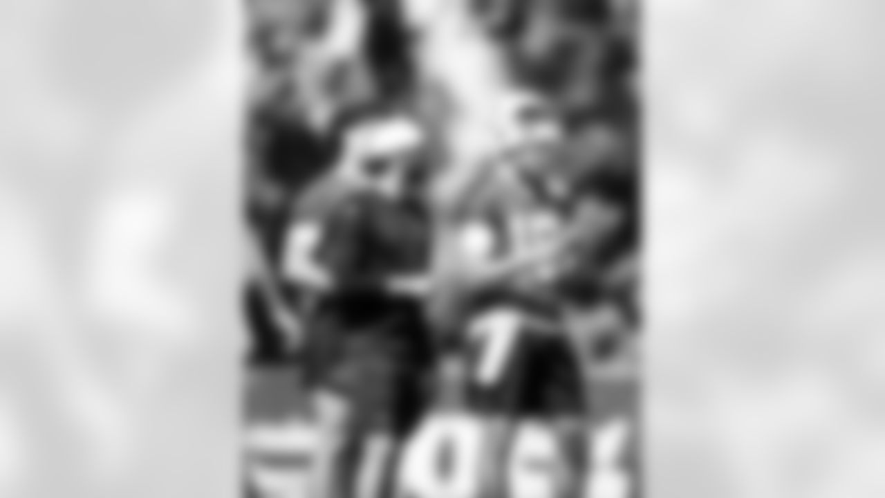 QuarterbacksCam Turner and QB Riley Leonard #15