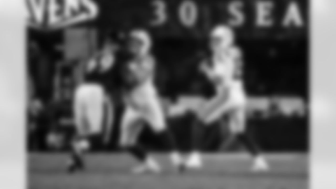 C Danny Pinter #63 and QB Riley Leonard #15