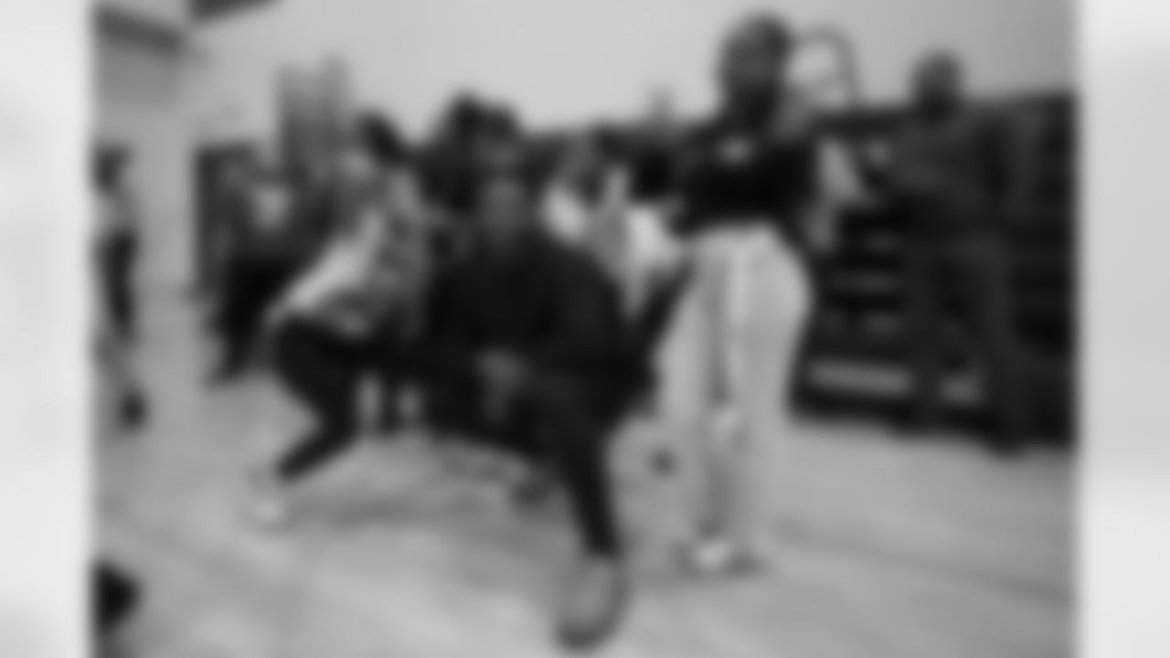 Colts linebacker Zaire Franklin poses for a photo with students during a GENYOUth clinic on Tuesday, Feb. 24, 2026, at Fall Creek Valley Middle School in Indianapolis. (Jerod Ringwald/AP Content Services for the NFL)