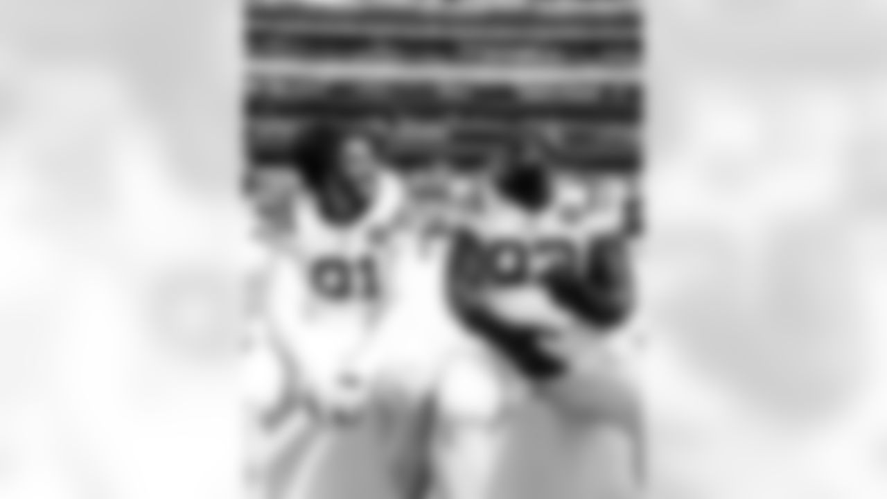 DE JT Tuimoloau #91 and DT Neville Gallimore #92