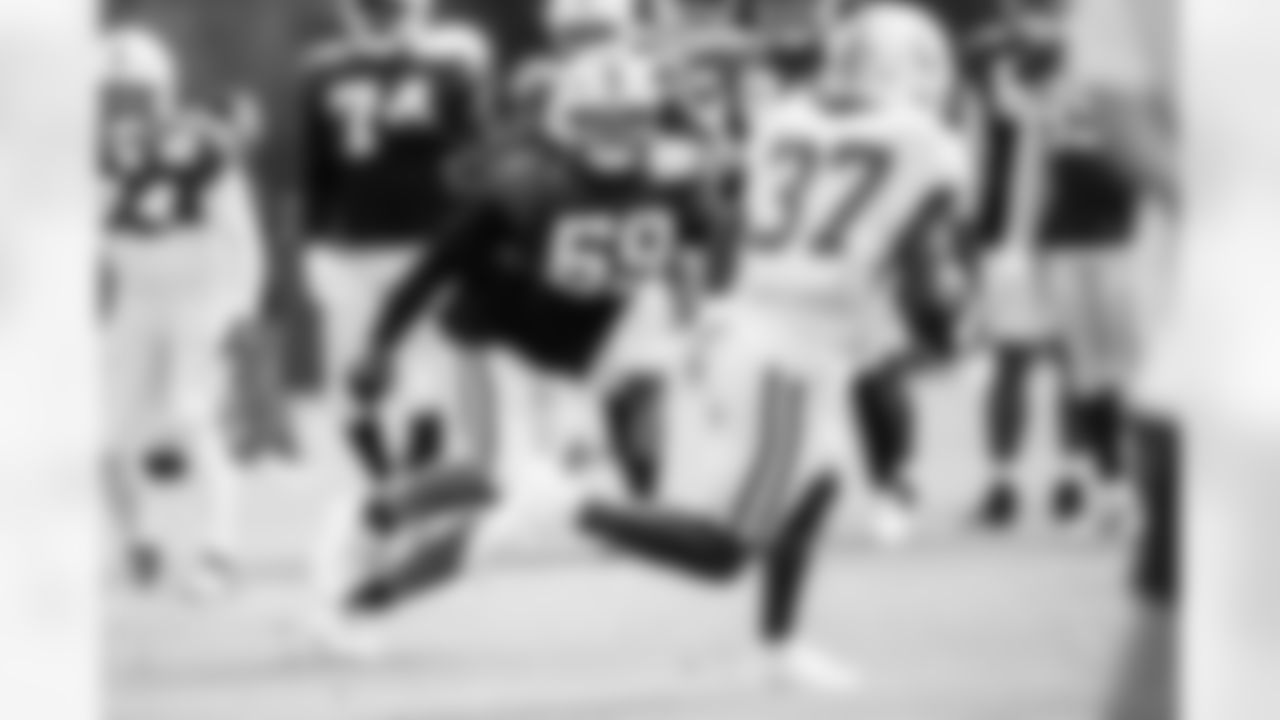 LB Buddy Johnson #59 and RB Ulysses Bentley IV #37