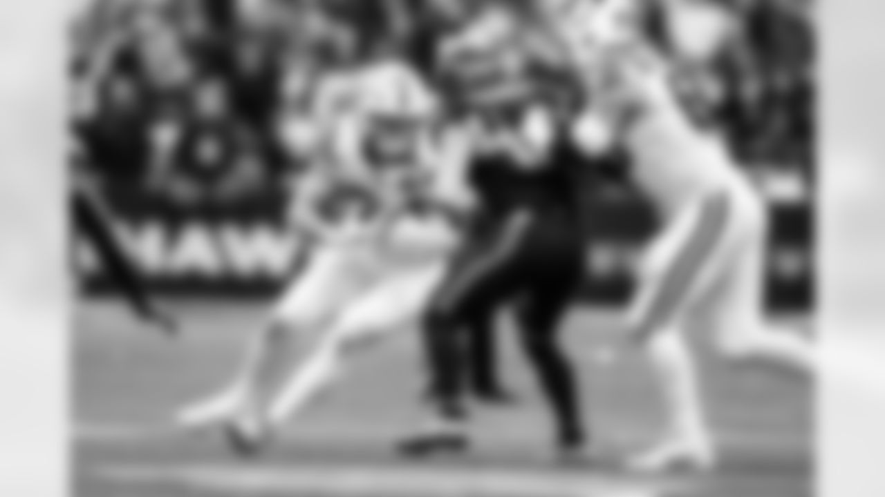 TE Tyler Warren #84 and C Tanor Bortolini #60