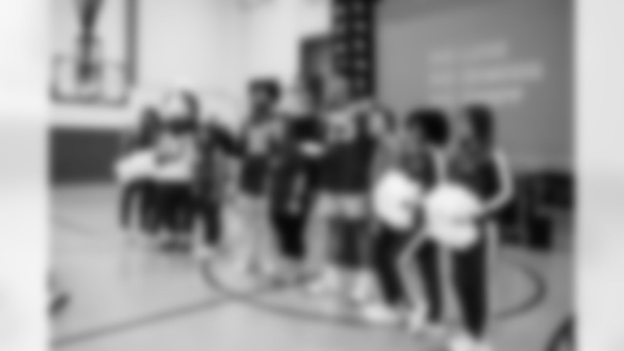 DE J.T. Tuimoloau #91, T Jalen Travis #75, Jada W. and Laura P.