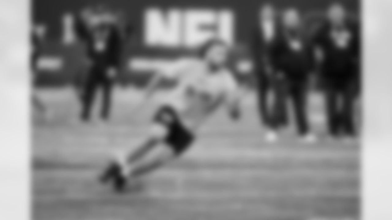 Wisconsin offensive lineman Tanor Bortolini runs a drill at the NFL football scouting combine, Sunday, March 3, 2024, in Indianapolis. (AP Photo/Darron Cummings)