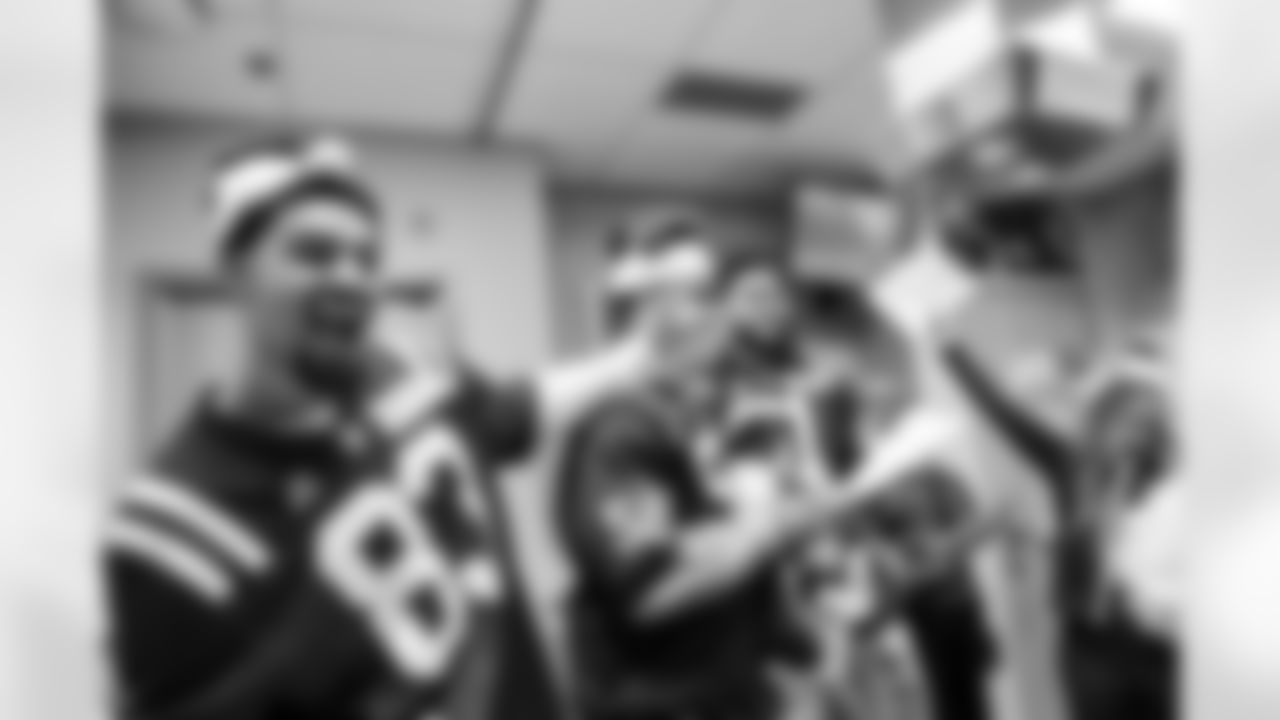 WR Eli Pancol #83, LB Austin Ajiake #58, DE Viliami Fehoko Jr. #96 and Allison B.