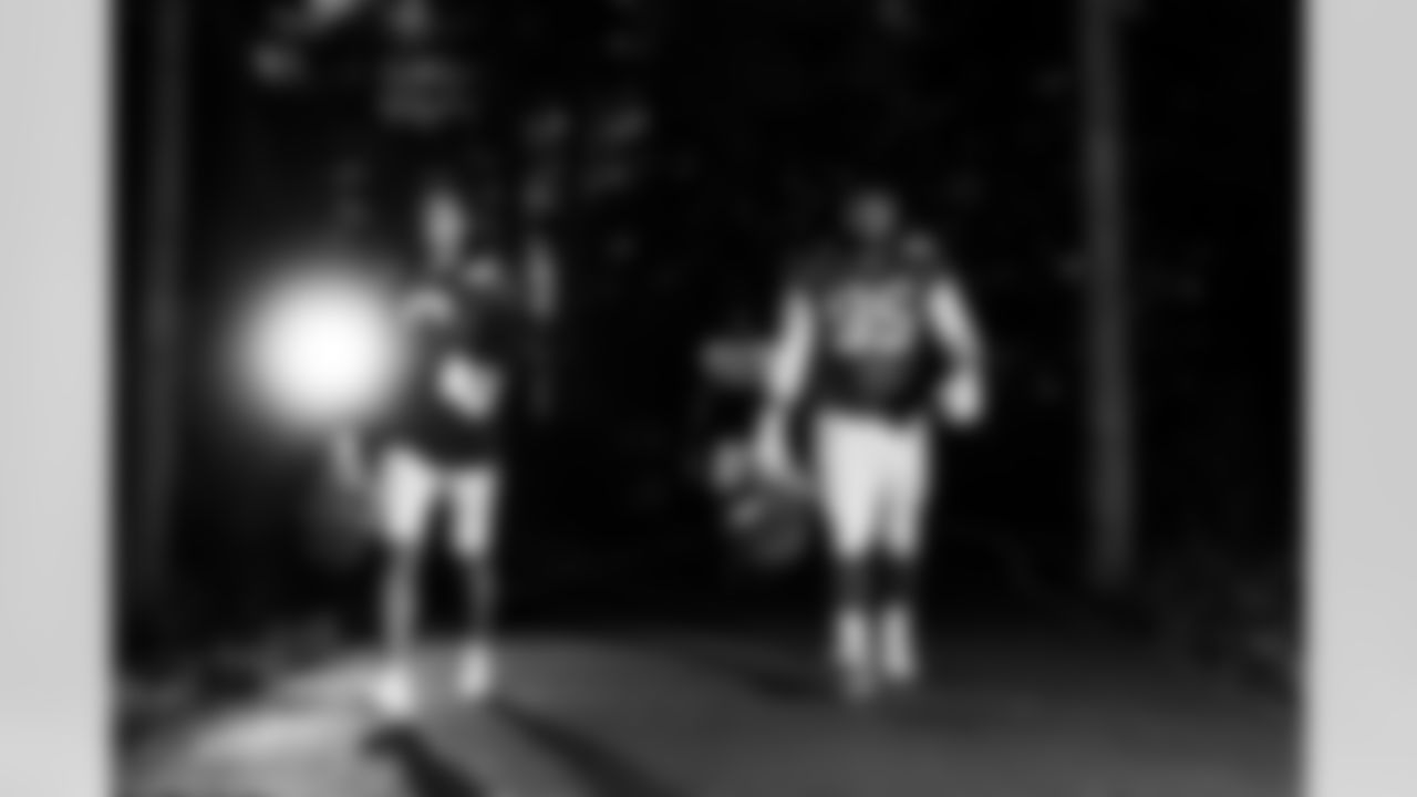 S Camryn Bynum #0 and DT Adetomiwa Adebawore #95