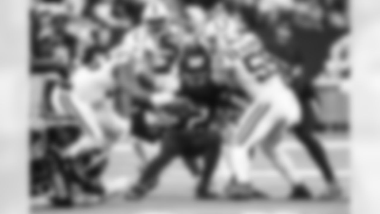 DT Adetomiwa Adebawore #95 and LB Cameron McGrone #59