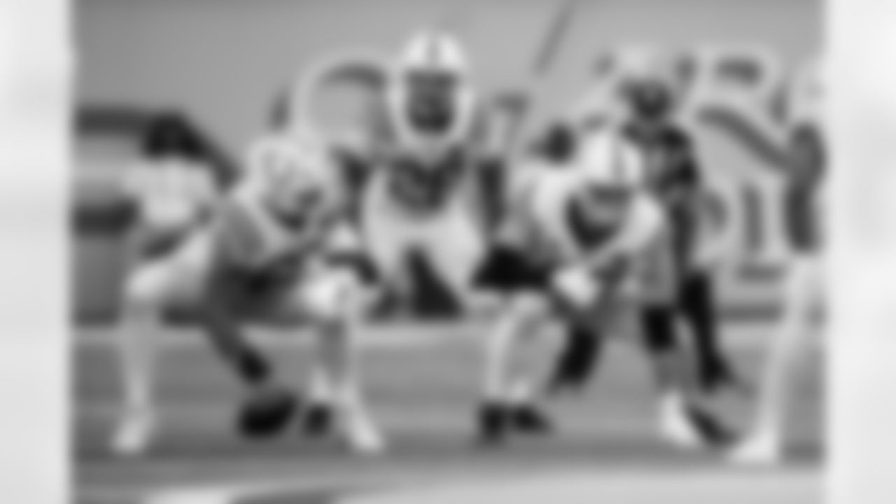 RB Jonathan Taylor #28, C Tanor Bortolini #60 and G Quenton Nelson #56