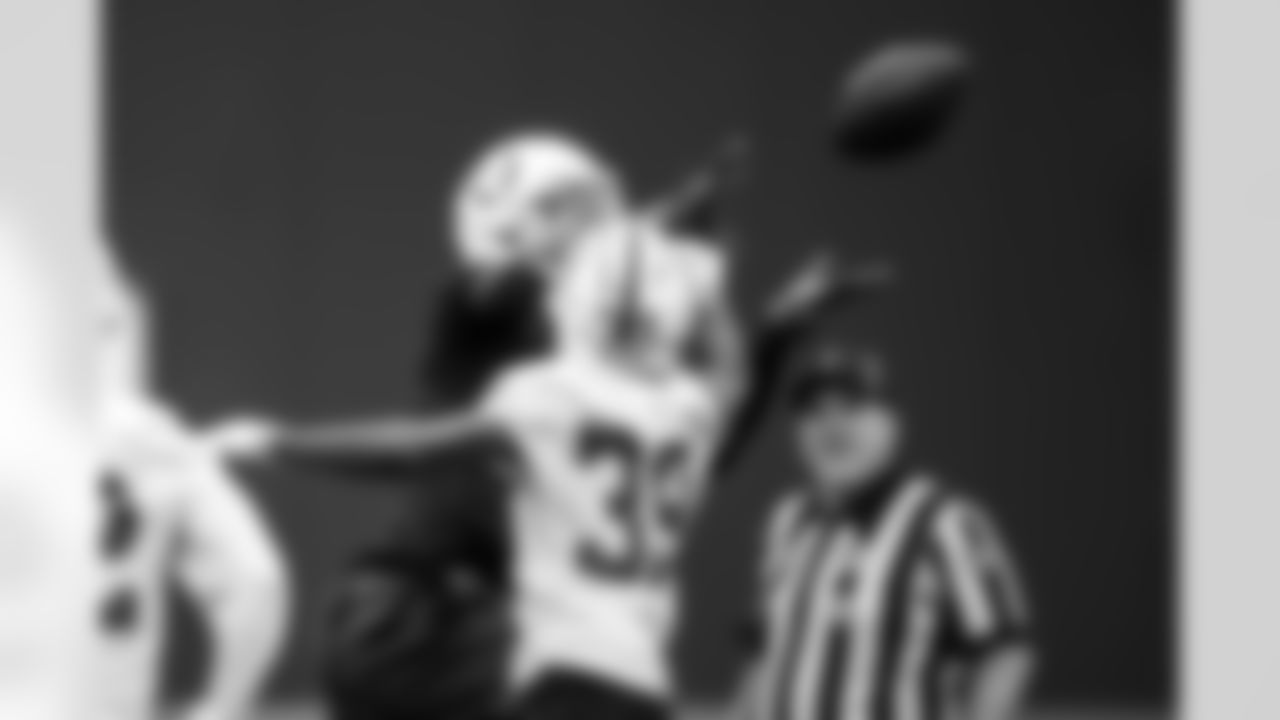 WR Adonai Mitchell #10 and CB Alex Johnson #39