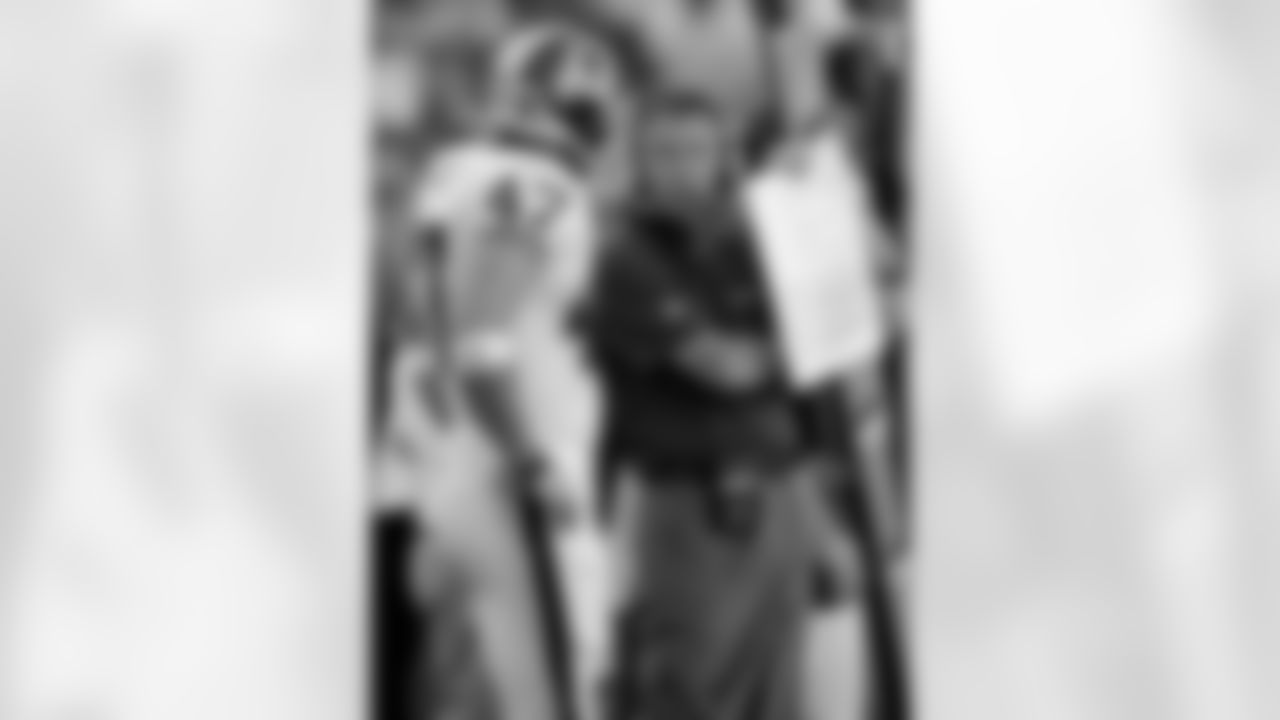 Washington Redskins head coach Jim Zorn with tight end Chris Cooley (47) against the St. Louis Rams during an NFL football game, Sunday, Oct 12, 2008 in Landover, Md. The Rams won 19-17.(AP Photo/Nick Wass)