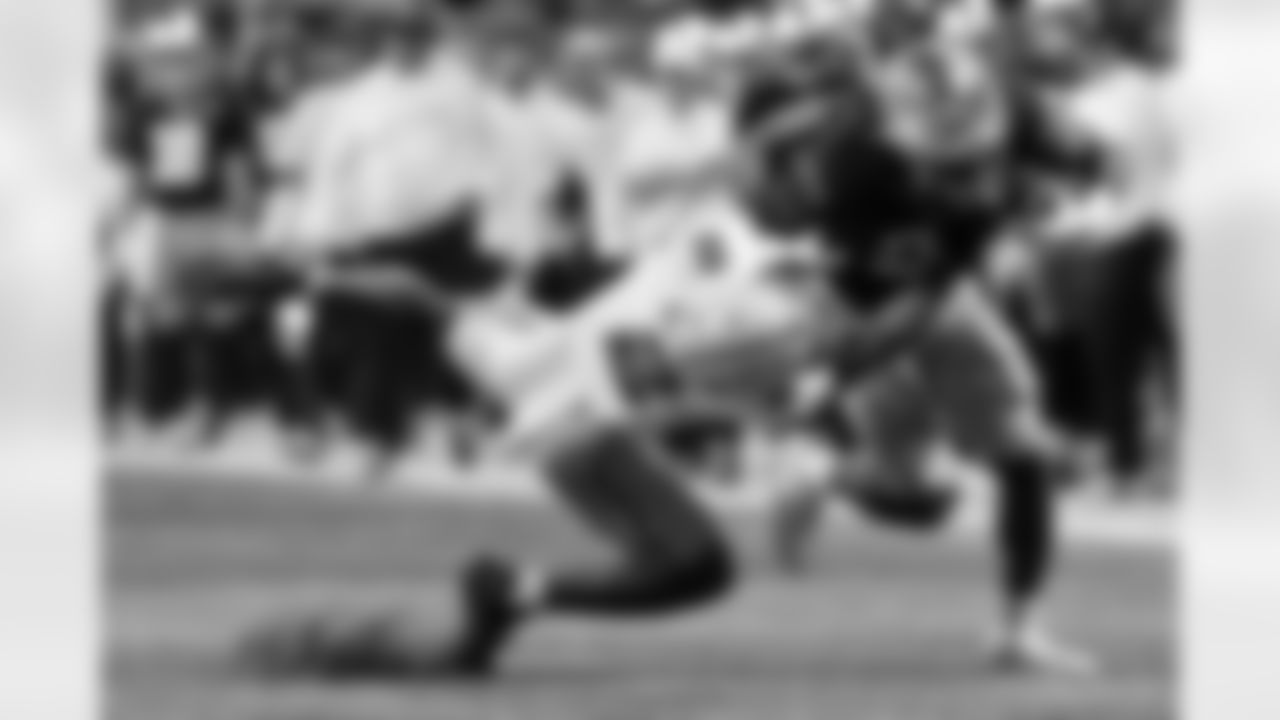 Notre Dame running back Jadarian Price is tackled by Ohio State safety Caleb Downs during first half of the College Football Playoff national championship game Monday, Jan. 20, 2025, in Atlanta. (AP Photo/Butch Dill)