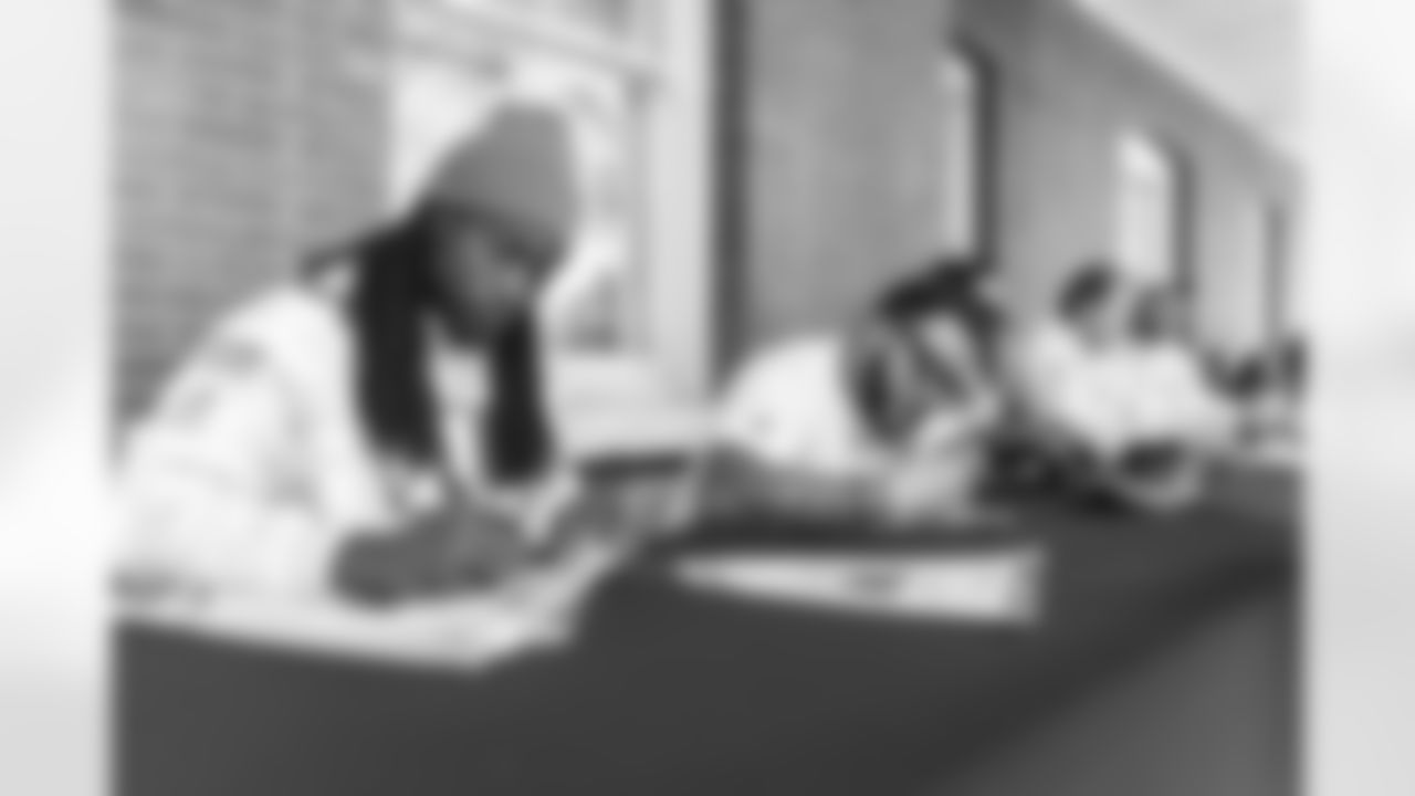 Images of Commander players and Command Force visiting Arlington National Cemetery with the USAA event staff at Fort Myers on October 21, 2025 in Landover, MD (Photo by Taylor Sims for Washington Commanders)