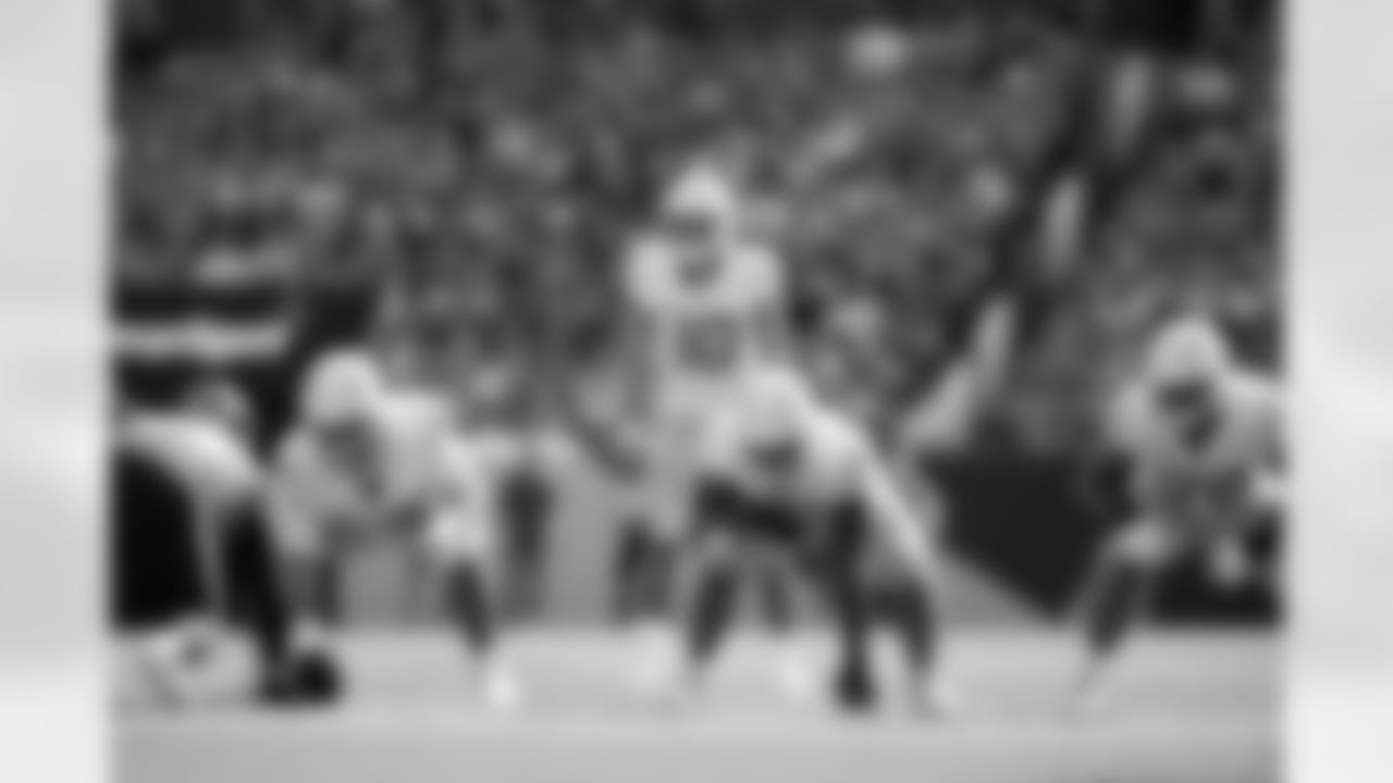Los Angeles Chargers quarterback Justin Herbert (10) gets set during an NFL football game against the Denver Broncos, Sunday, Oct. 13, 2024 in Denver. (Brooke Sutton via AP)