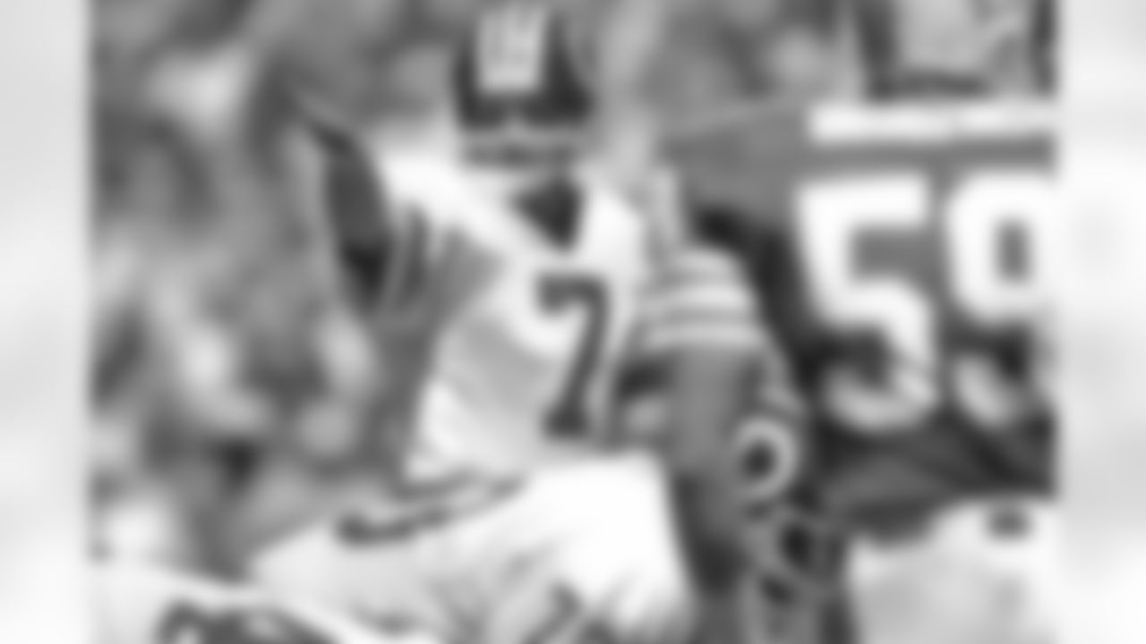 Washington Redskins quarterback Joe Theismann (7) calls signals during a Sept. 2, 1984 NFL football game against the Miami Dolphins in Washington. (AP Photo / Al Messerschmidt)