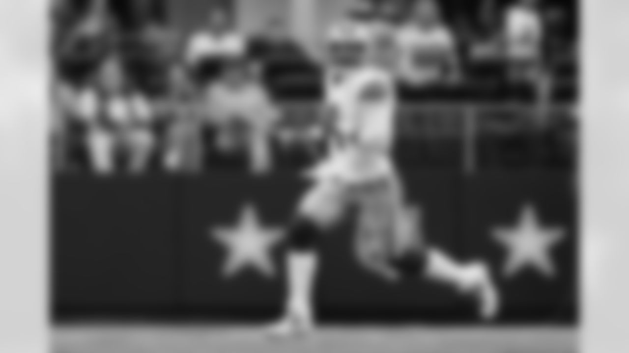 Dallas Cowboys quarterback Dak Prescott rolls out to pass during the first half of a football game against the New Orleans Saints Sunday, Sept. 15, 2024, in Arlington, Texas. (AP Photo/Jeffrey McWhorter)
