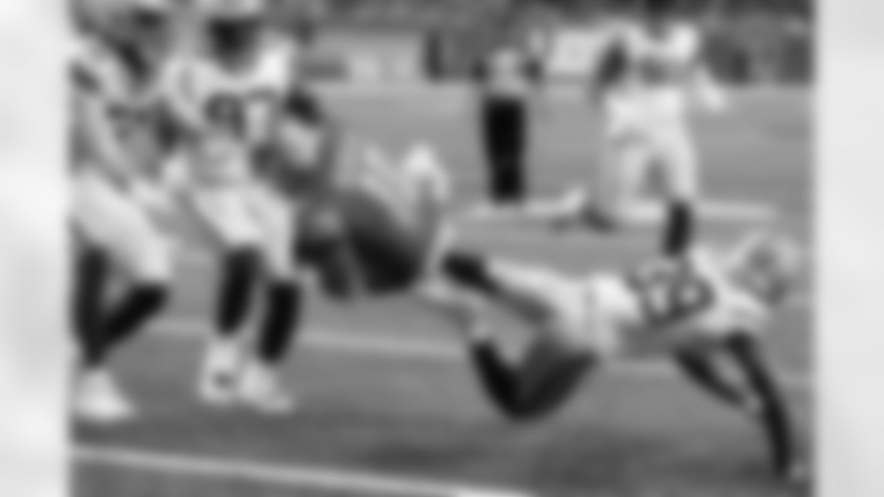 Detroit Lions quarterback David Blough (10) flips over Green Bay Packers defensive back Chandon Sullivan (39) at the 1-yard line during the first half of an NFL football game, Sunday, Dec. 29, 2019, in Detroit. (AP Photo/Carlos Osorio)