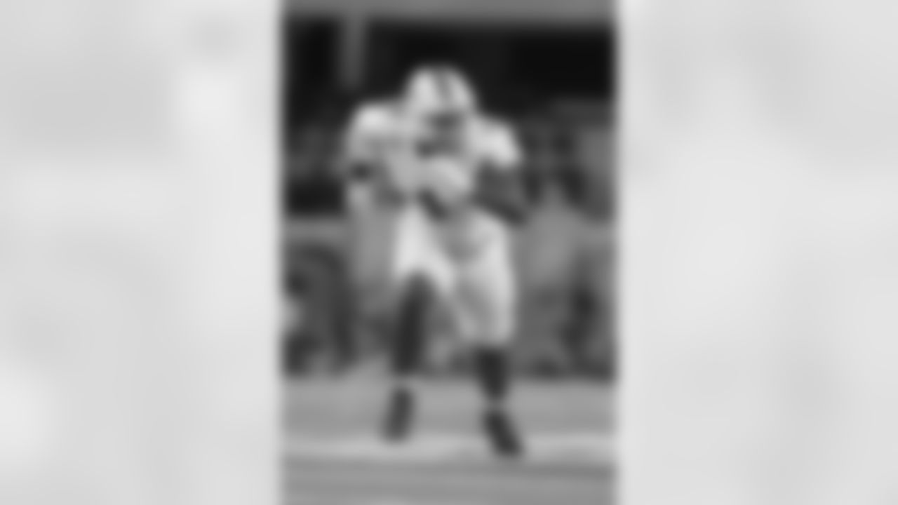 Miami defensive lineman Rueben Bain Jr. rushes in on the Ohio State offense during the first half of the Cotton Bowl College Football Playoff quarterfinal game Wednesday, Dec. 31, 2025, in Arlington, Texas. (AP Photo/Julio Cortez)