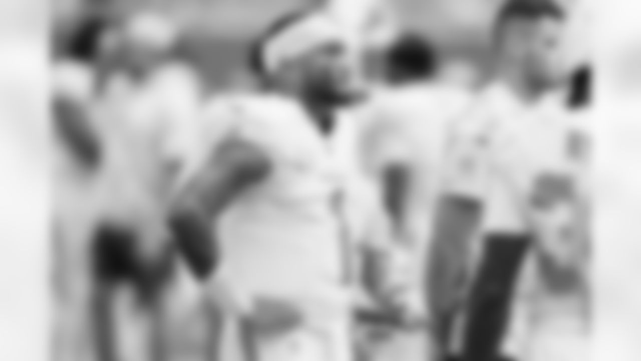 Miami Dolphins quarterback Tua Tagovailoa (1) stands on the sidelines during an NFL football game against the Las Vegas Raiders, Sunday, Nov. 17, 2024, in Miami Gardens, Fla. (AP Photo/Doug Murray)