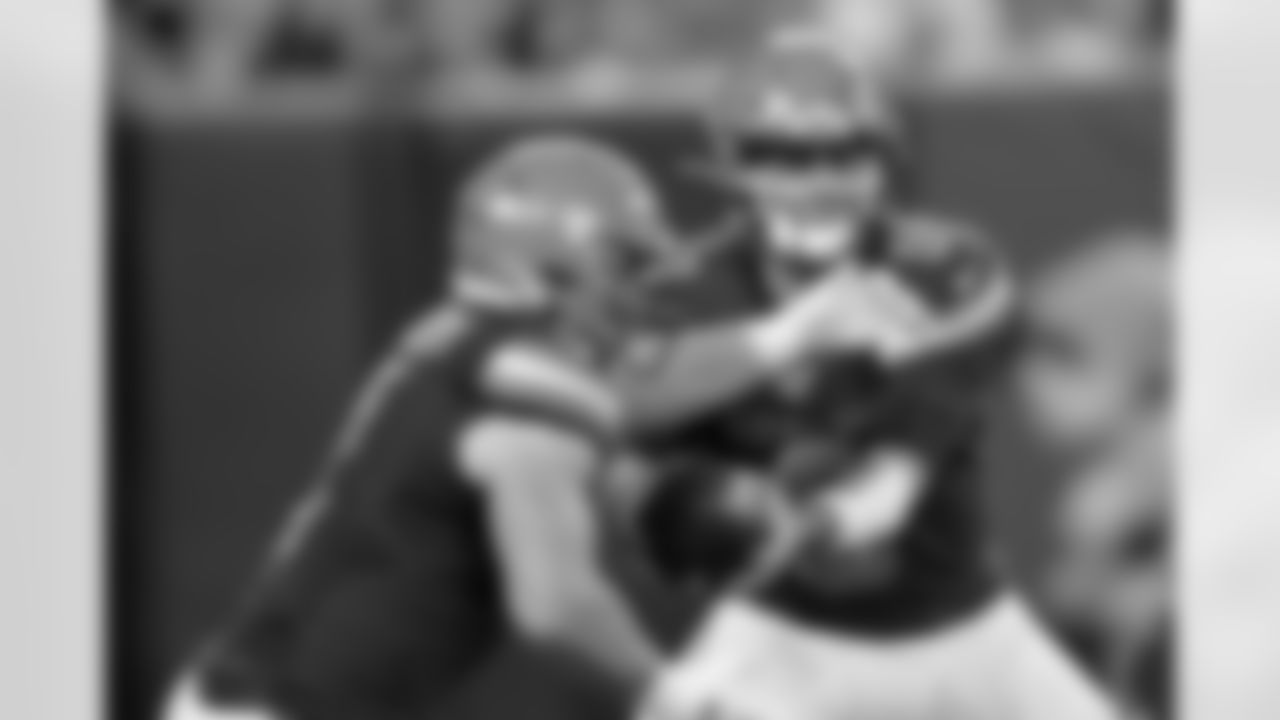 Cleveland Browns quarterback David Blough, right, hands off to A.J Ouellette during the second half of an NFL preseason football game against the Detroit Lions, Thursday, Aug. 29, 2019, in Cleveland. (AP Photo/Ron Schwane)