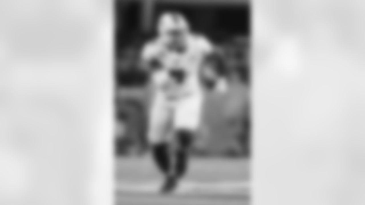 Miami defensive lineman Rueben Bain Jr. rushes in during the Cotton Bowl College Football Playoff quarterfinal game between Ohio State and Miami Wednesday, Dec. 31, 2025, in Arlington, Texas. (AP Photo/Julio Cortez)