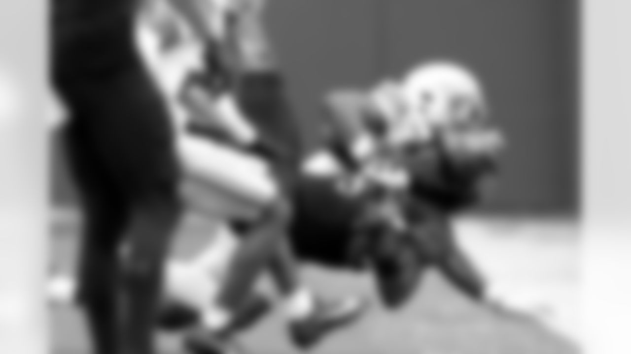 Northwestern wide receiver A.J. Henning catches a pass from quarterback Jack Lausch as Ohio State safety Caleb Downs during the first half of an NCAA college football game at Wrigley Field on Saturday, Nov. 16, 2024, in Chicago. (AP Photo/Charles Rex Arbogast)