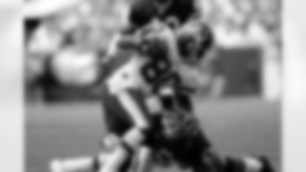 David Patten #80 of the Washington Redskins gets tackled after a catch by Charles Tillman #33 of the Chicago Bears during an NFL football game on Sept. 11, 2005 in Landover, Md. The Redskins defeated the Bears 9-7. (Joe Robbins via AP)