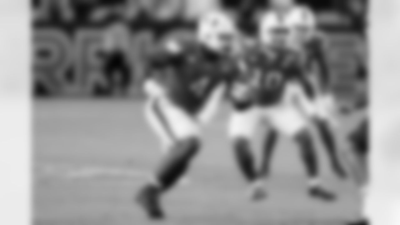 Miami defensive lineman Rueben Bain Jr. (4) runs a play during an NCAA football game against Louisville on Friday, Oct. 17, 2025 in Miami Gardens, Fla. (AP Photo/Doug Murray)