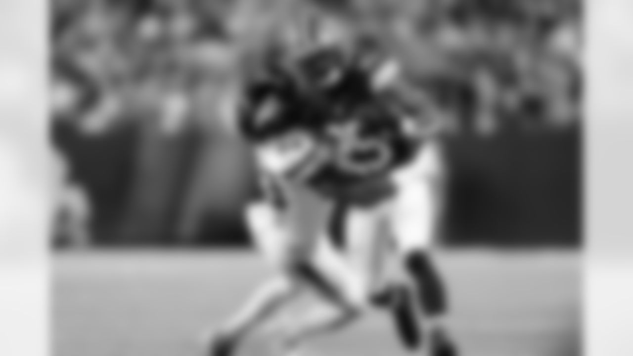 Cleveland Browns running back Demetric Felton Jr. (25) is tackled by linebacker Zaire Barnes (53) during the Hall of Fame NFL football preseason game Thursday, Aug. 3, 2023, in Canton, Ohio. The Browns won 21-16. (Ben Liebenberg via AP)